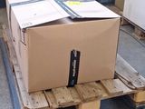 a large box on a pallet in the middle of a warehouse