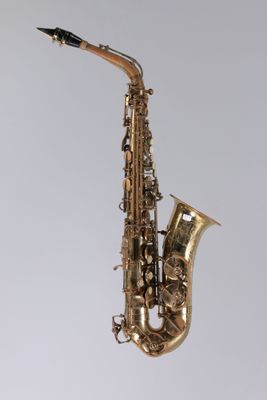 a close up of a saxophone on a white background