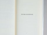an open book on a table with the words etude en rouge written on it