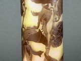 a tall vase with a picture of a woman on it