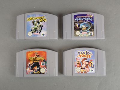 three nintendo game cartridges are sitting on a table next to each other