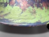 a close up view of a colorful bowl on a table