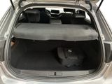 a trunk of a car with luggage inside of it