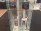 a glass display case with a lot of electronics inside of it