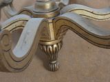a brass candle holder with candles on top of it