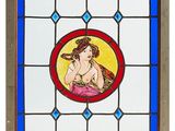 a picture of a stained glass window with a woman on it
