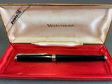 an image of a pen sitting in a red box on a table