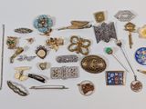 many different types of jewelry on a white surface
