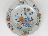 a plate with a flower design on it on a table
