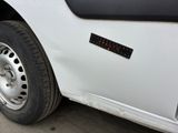 a white truck that has a sticker on the side of it
