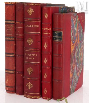 five red books sitting on top of each other on a table