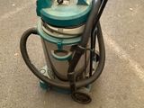 a vacuum cleaner that is sitting on the ground