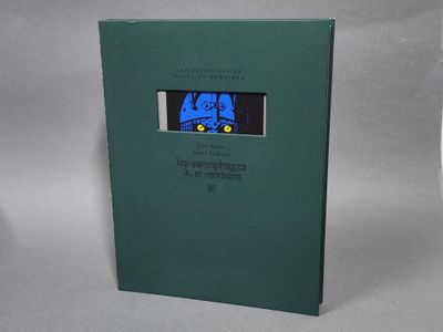un livre vert sur lequel figure l'image d'un chat