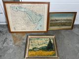 Deux cartes encadrées et une photo d'un champ de blé sont posées par terre