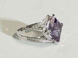 purple amethorate and diamond ring on a white surface