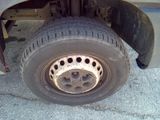 a close up of a flat tire on a truck