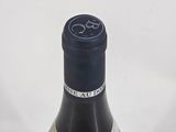a bottle of wine that is sitting on a table
