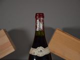a bottle of wine that is sitting on a table