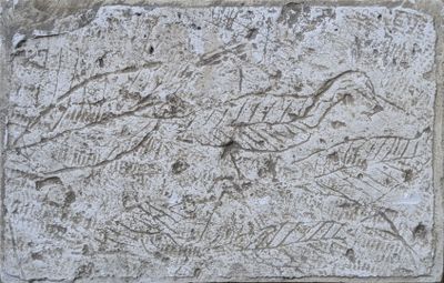 a close up of a stone block with a drawing on it