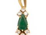 an emerald and diamond pendant on a white background