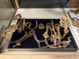 a display case with a lot of gold items in it
