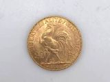 an image of a gold coin with a rooster on it