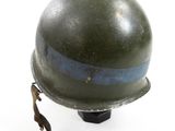 a green helmet with a blue stripe on the side of it