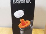 the box of a blender is sitting on a wooden table