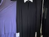 three women ' s shirts hanging on a clothes rack in a closet