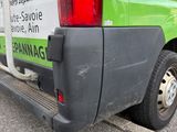 a green van that is parked on the side of the street
