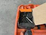 a box with screws and a hammer in it