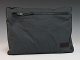 the bag is grey and has a zipper on the side