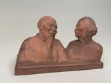 paire de figurines chinoises représentant un vieil homme et une vieille femme