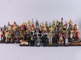 a close up of a group of figurines on a white surface
