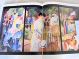 an open book with a picture of a woman and a dog