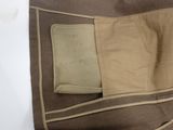 a brown and tan bag with a pocket on it