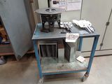 a machine that is sitting on a cart in a room