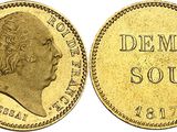 a gold coin with the image of a man ' s head on it