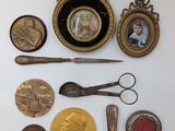 a picture of a collection of antique items on a table