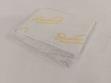 a small piece of paper with a yellow writing on it