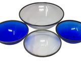 three blue and white bowls sitting next to each other on a white surface
