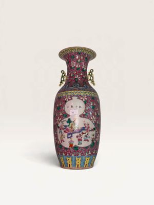 a vase with a picture of a woman and a cat on it