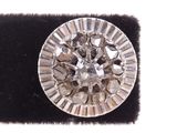 an image of a diamond ring on a black velvet surface
