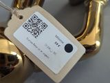 a gold bell with a qr code on it