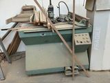 a machine that is sitting in the middle of a pile of wood