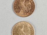 two gold coins with a rooster on the front and a rooster on the back