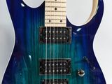 a close up of a blue electric guitar on a white background