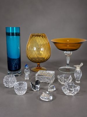 a lot of glass items that are sitting on a table