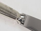 a knife that is sitting on top of a table