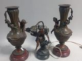 three vases that are sitting on a table